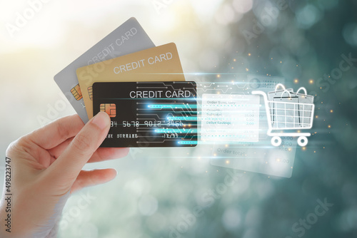 Woman hand holding various credit cards to pay for shopping. Online shopping payment by credit card concept. Credit card spending.