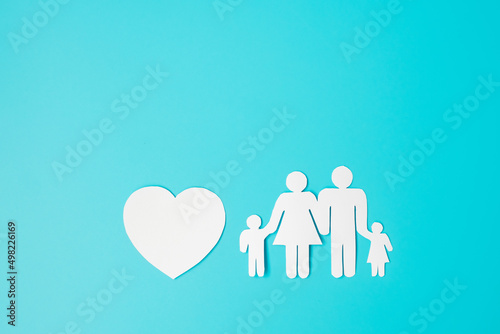 Happy Family day. paper shape cutout with Father  Mother  Children and heart. international day of families  Warm home  love  Foster  Insurance  Charity and Donation concepts.