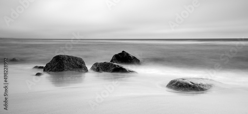 Stones on the beach. Black and white photography.