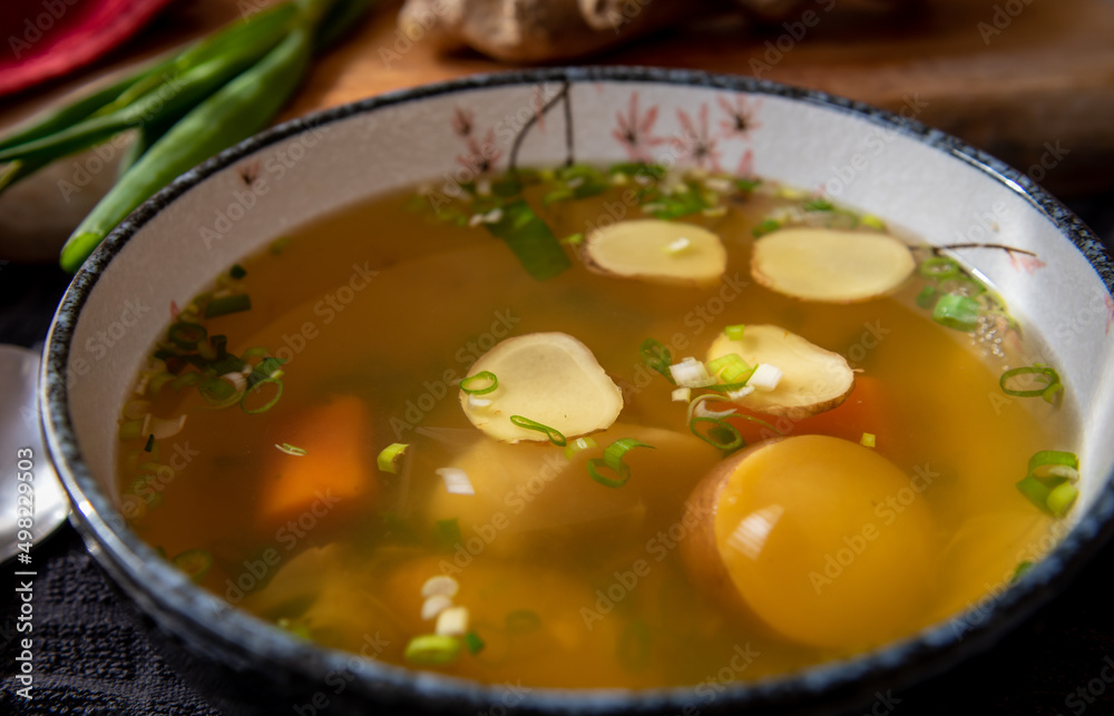 A bowl of ginger, onion soup with vegetables. Fat free and full of goodness especially when one is feeling unwell.