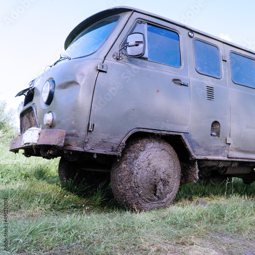 Dirty wheel of an old military SUV in sticky mud