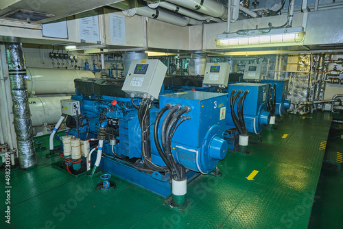 Diesel generators, auxiliary engines in engine room of cargo vessel