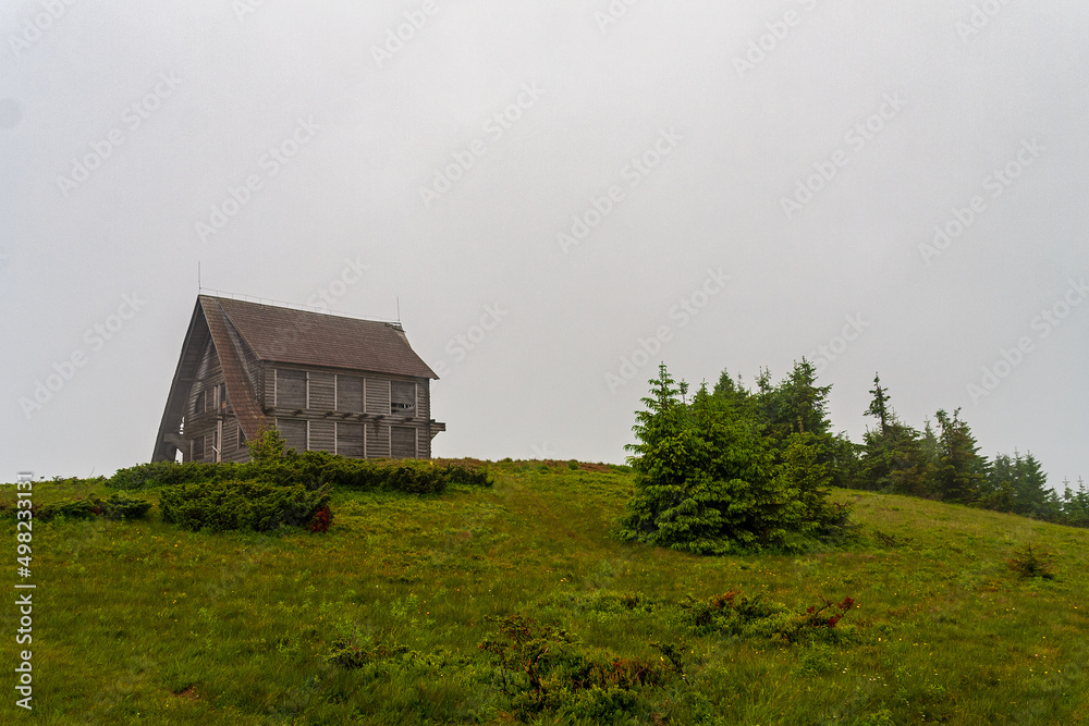 Fototapeta premium Lonely house on top of a mountain