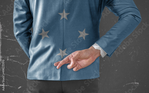 Businessman Jacket with Flag of Federate States of Micronesia with his fingers crossed behind his back