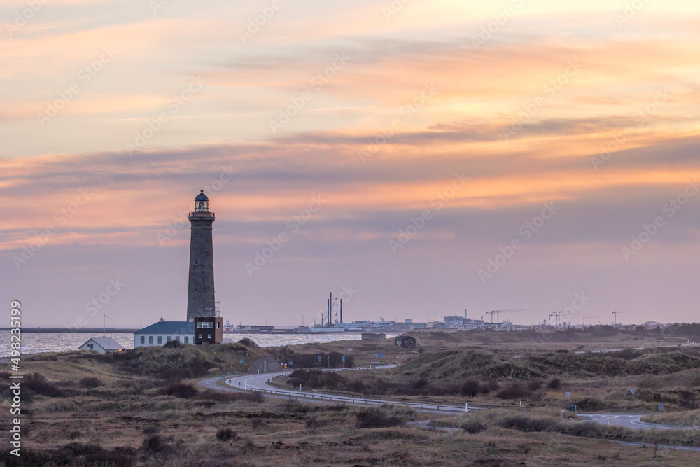 The lighthouse of Grenen at the most northern point of Denmark at sunset at a cold day in spring.