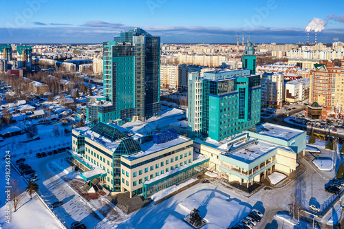 Surgut city in winter. Gazprom Transgaz Surgut and Gazprombank buildings. Aerial view.