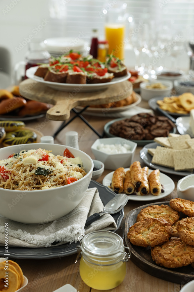 Brunch table setting with different delicious food indoors