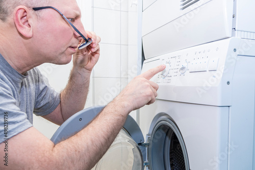 man, Caucasian, washing machine, repair, program setting, electronic settings, program installation, problem, man, homework, lifestyle, white goods, at home, inside, European, one man, male, person, e