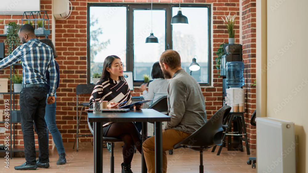 HR employee greeting man with job application at hiring meeting, having resume for recruitment. Female worker talking to applicant at job interview for business career work. Employment offer HR employee greeting man with job application at hiring meeting, having resume for recruitment. Female worker talking to applicant at job interview for business career work. Employment offer