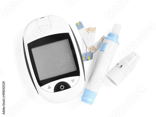 Glucometer, lancet pen and strips on white background, top view. Diabetes testing kit