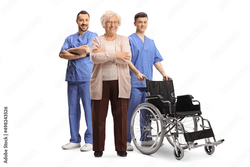 Elderly female patient and two male doctors with a wheelchair Elderly female patient and two male doctors with a wheelchair