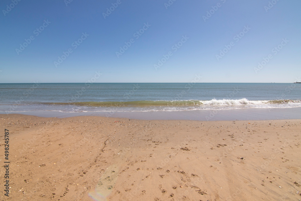Isla Cristina beach, Huelva, Spain. A blue sky and fine sand. Concept of the best beaches. Isla Cristina beach, Huelva, Spain. A blue sky and fine sand. Concept of the best beaches.