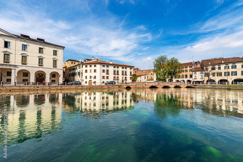 Cityscape of Treviso downtown with the river Sile with the street called Riviera Garibaldi and the small bridge called Ponte Garibaldi. Veneto, Italy, Europe.
