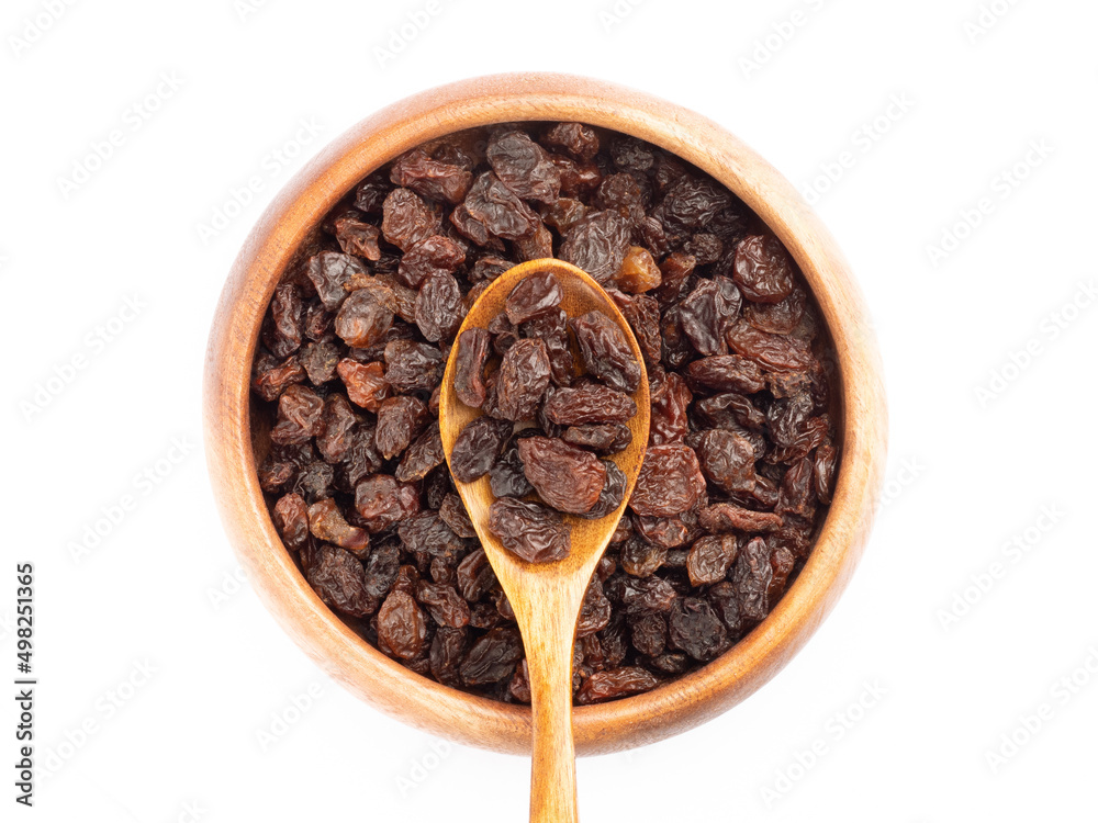Raisin in spoon and bowl isolated on white background. Macro