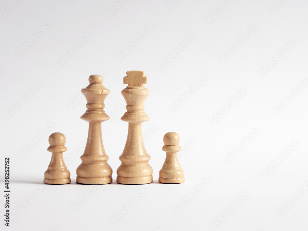 Chess pieces representing a family with two kids. Chess pieces representing a family with two kids.
