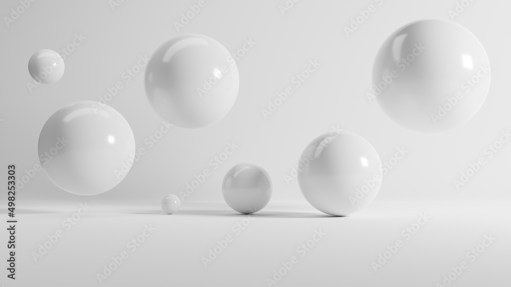 Abstract 3d rendering of white shiny spheres on white background.