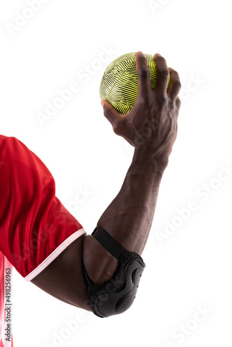 African american handball player wearing elbow guard holding green ball against white background