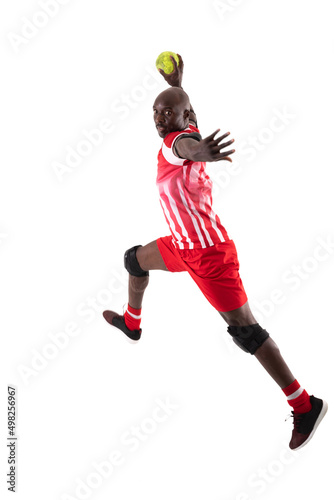 Confident african american young male handball athlete throwing ball against white background
