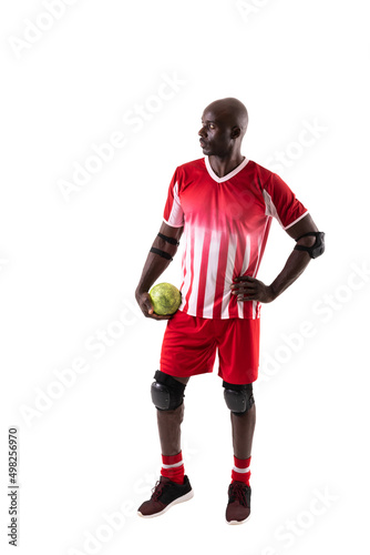 Young african american male handball player holding ball looking away against white background