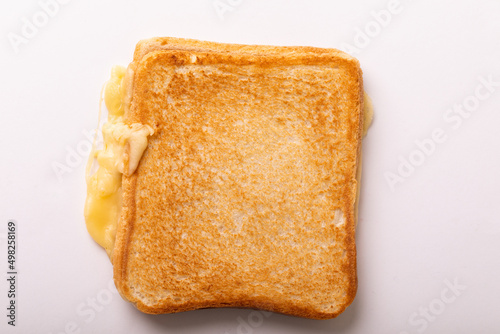 Directly above view of fresh cheese toast sandwich over white background