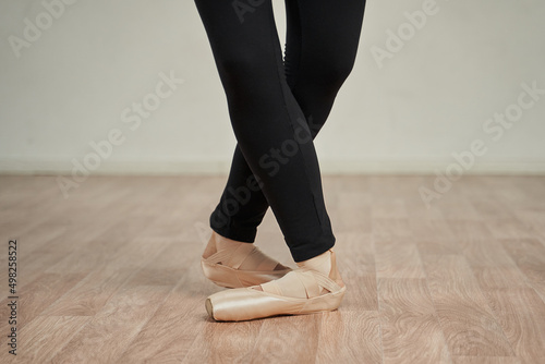 ballerina's legs in pointe shoes close-up. ballerina legs in fifth position