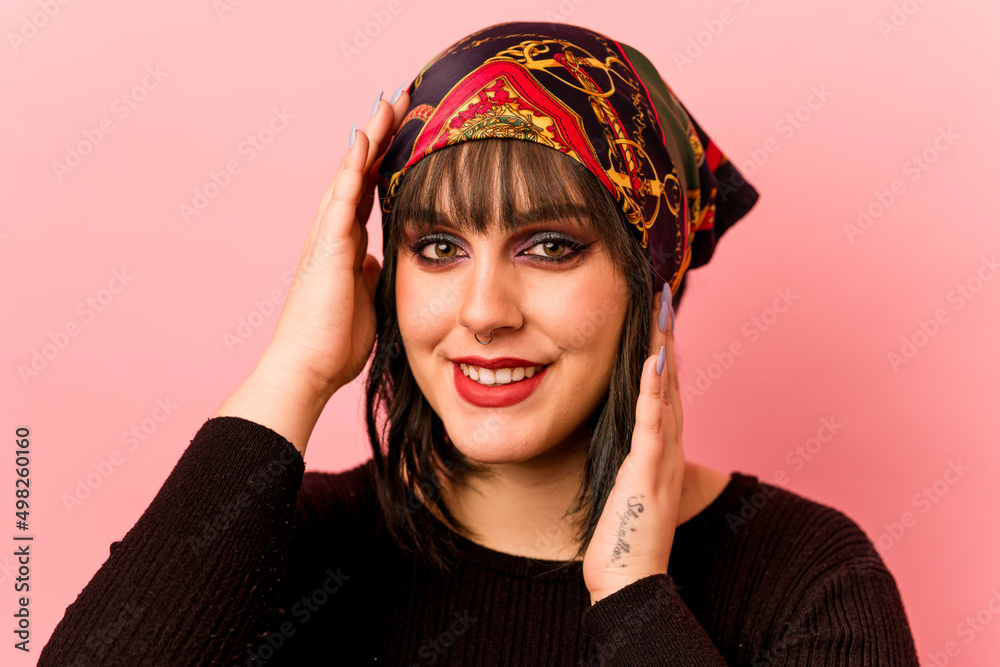 Young caucasian makeup artist woman isolated on pink background Young caucasian makeup artist woman isolated on pink background
