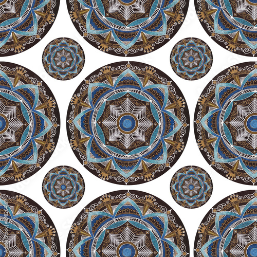 Decorative tile mosaic with blue and gold colors. Seamless pattern with mandala on white background.