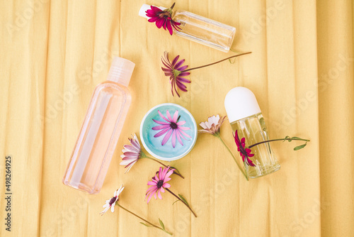 Still life of eco cosmetics with fresh flowers photo