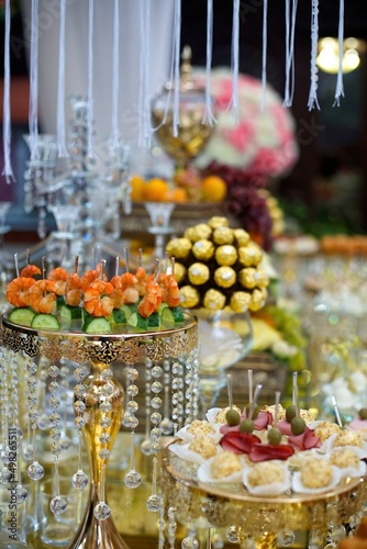 Sweet table candy bar on a holiday in honor of a wedding or children 's holiday.