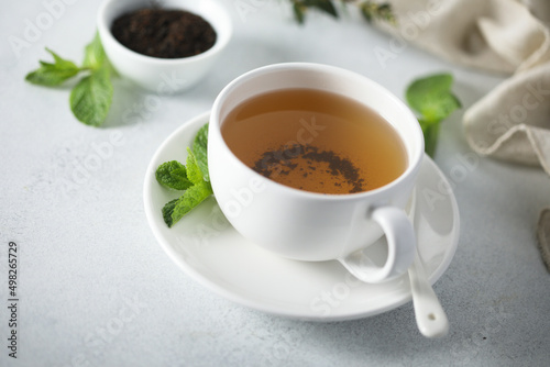 Healthy homemade mint tea in a white cup