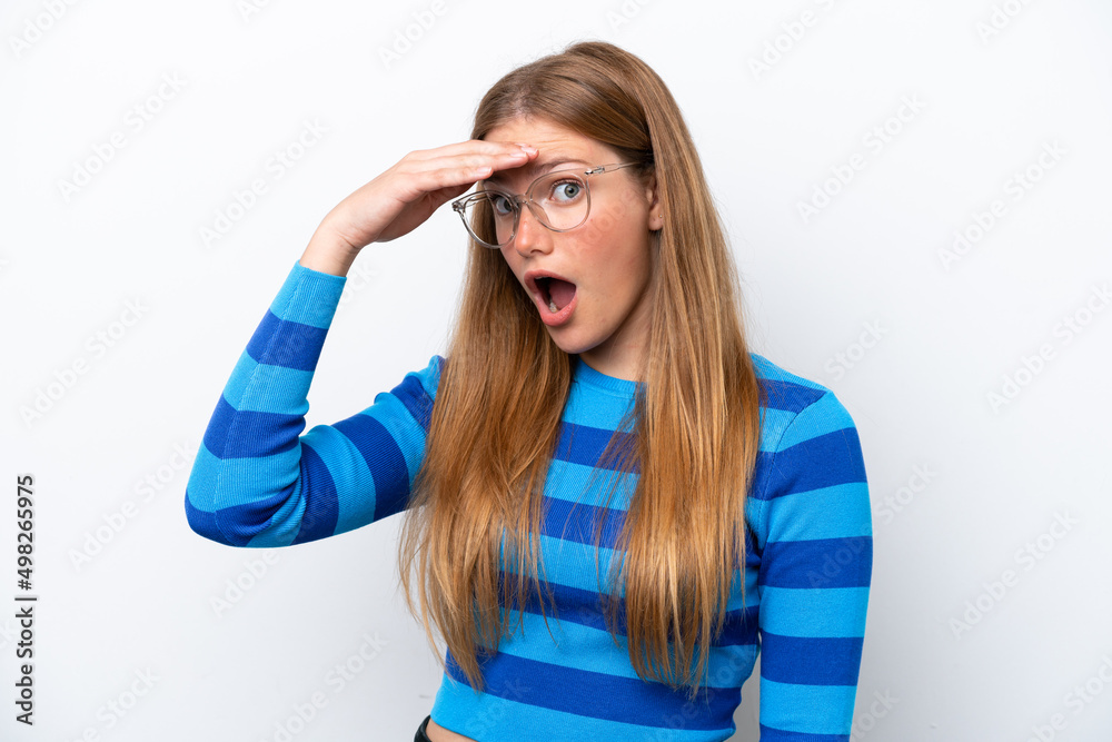 Young caucasian woman isolated on white background doing surprise gesture while looking front Young caucasian woman isolated on white background doing surprise gesture while looking front