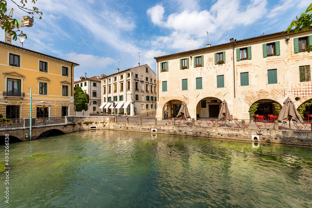 Cityscape of Treviso downtown with the river Sile with the street called Via Pescheria (fish market street and island). Veneto, Italy, Europe.