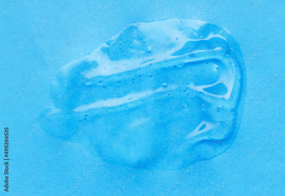 texture of white cream on a blue background texture of white cream on a blue background