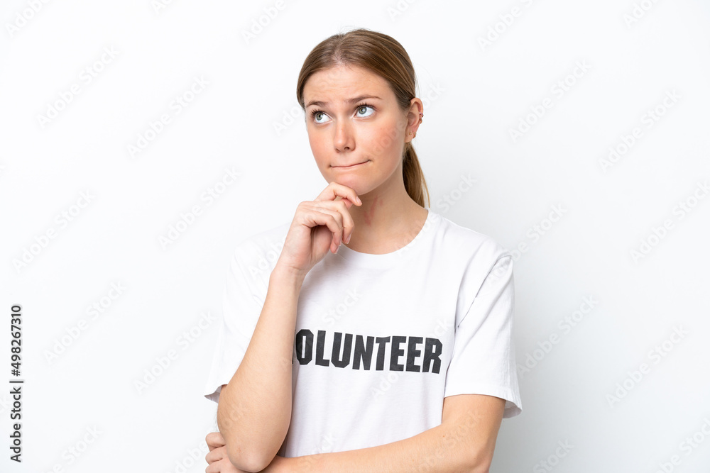 Young volunteer woman isolated on white background having doubts and thinking Young volunteer woman isolated on white background having doubts and thinking