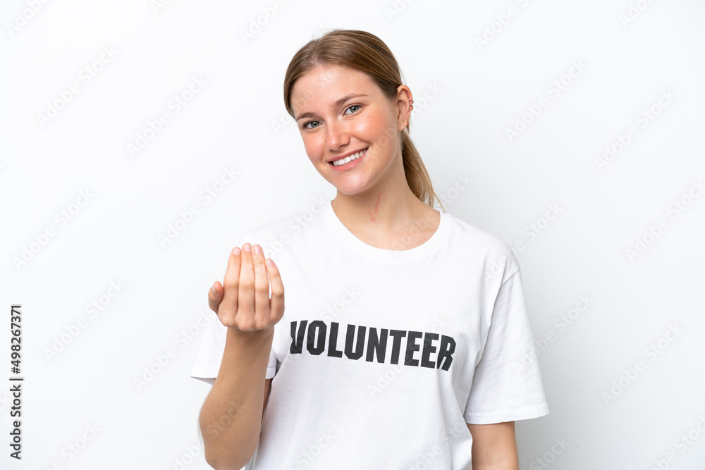 Young volunteer woman isolated on white background inviting to come with hand. Happy that you came Young volunteer woman isolated on white background inviting to come with hand. Happy that you came