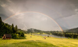 Summer thunderstorm with rainbow at Bavarian alps Geroldsee