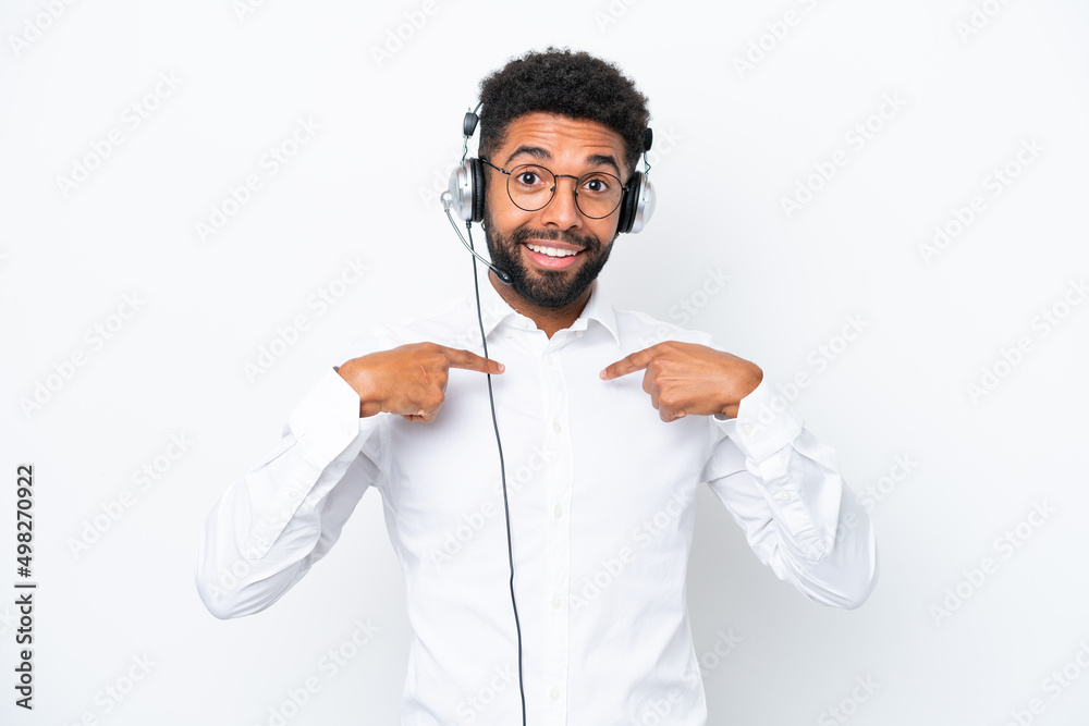 Telemarketer Brazilian man working with a headset isolated on white background with surprise facial expression Telemarketer Brazilian man working with a headset isolated on white background with surprise facial expression
