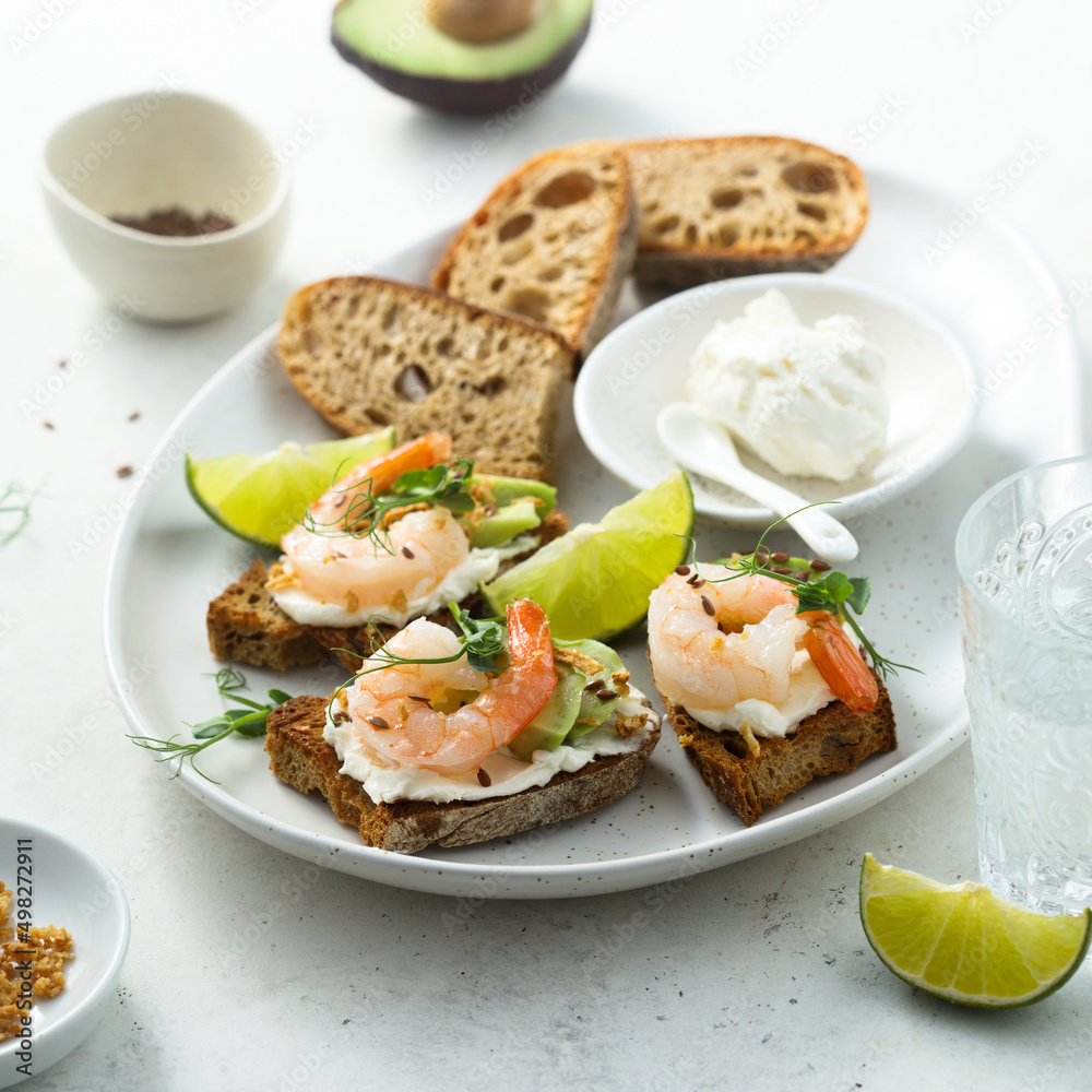 Roasted shrimps with cream cheese on toast