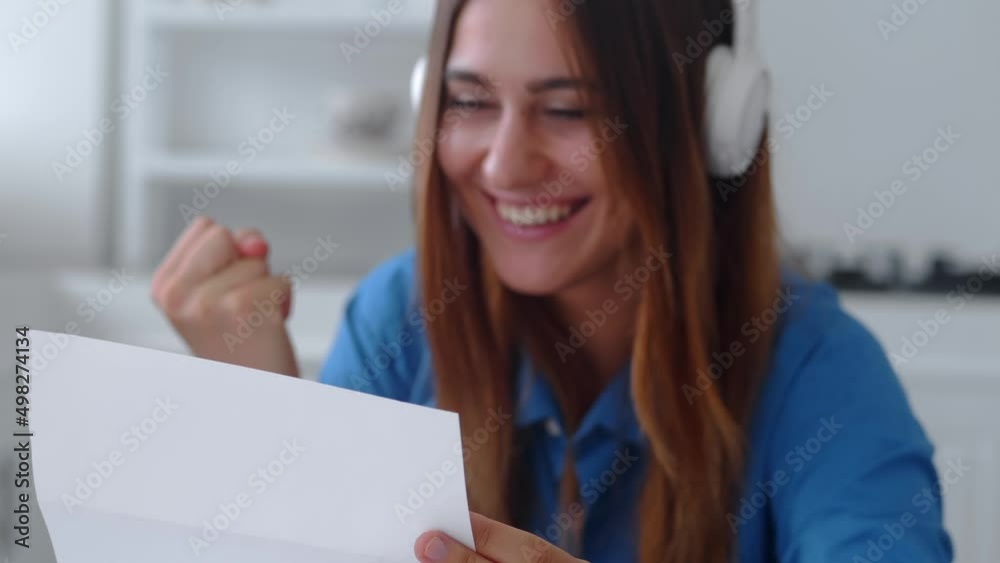 Young caucasian woman getting mail feel excited with job offer being hired accepted to college university. Amazed millennial female read great news in official letter.