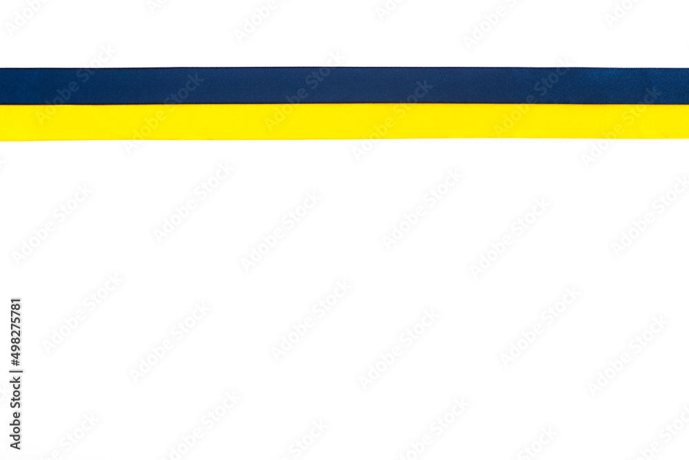 Colorful blue-yellow fabric ribbon isolated on white. The symbol of the state. Copy space. National pennant Colorful blue-yellow fabric ribbon isolated on white. The symbol of the state. Copy space. National pennant