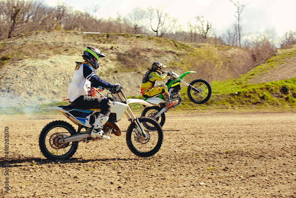 Obraz premium motocross bike race speed and power in extreme man sport ,sport action concept