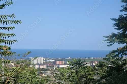28.08.2021 Dagestan. the city of Derbent in the distance, the blue sea and the sky.