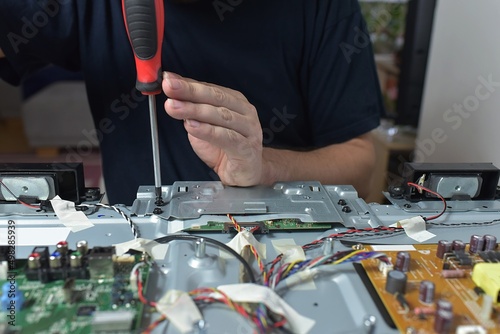 The man repairing broken tv 