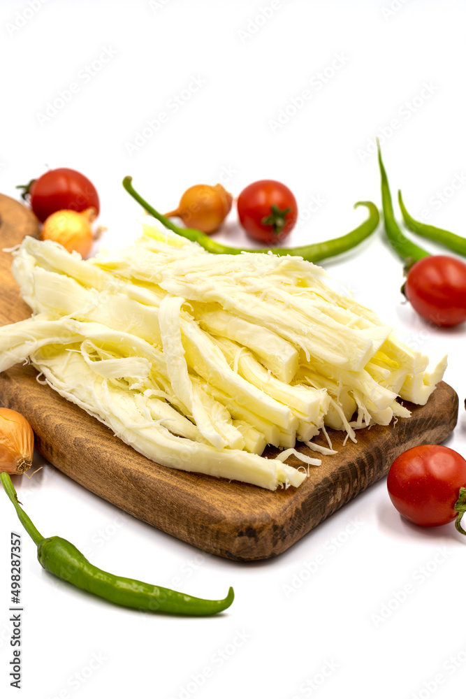 Cecil cheese or String cheese isolated on a white background. Delicious assortment of cheeses. close up Cecil cheese or String cheese isolated on a white background. Delicious assortment of cheeses. close up
