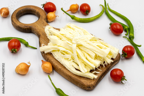Cecil cheese or String cheese on a white background. Delicious assortment of cheeses. close up