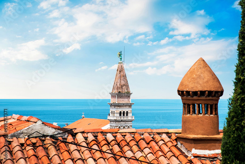 Obraz na płótnie Beautiful landscape with a spire of Saint George's Church of Piran, Slovenia. Amazing places. w salonie