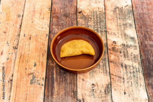 tasty typical Colombian empanadas, are made with yellow corn flour and a delicious filling of pork and beef, both seasoned and mixed with cooked potato