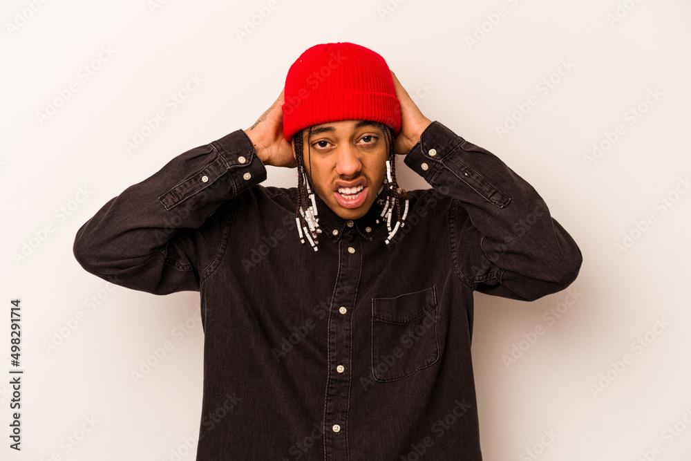 Young African American man isolated on white background screaming, very excited, passionate, satisfied with something. Young African American man isolated on white background screaming, very excited, passionate, satisfied with something.