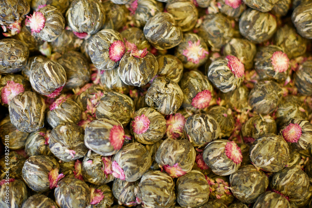 Flowering traditional chinese bound green tea. Dry tea for sale at market Flowering traditional chinese bound green tea. Dry tea for sale at market