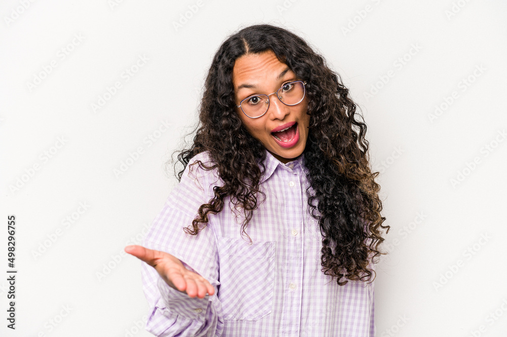 Young hispanic woman isolated on white background stretching hand at camera in greeting gesture. Young hispanic woman isolated on white background stretching hand at camera in greeting gesture.